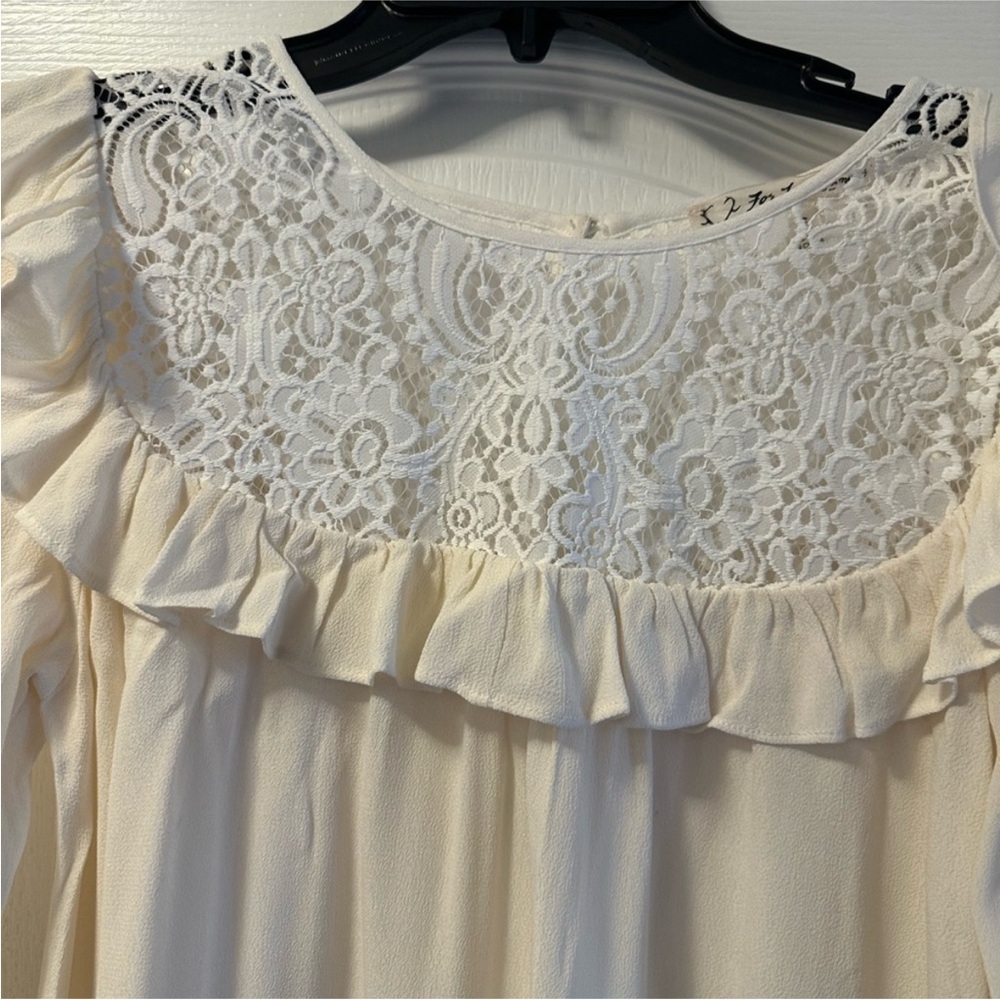 For love and lemons long sleeve  ruffle blouse Sz S 
P-P 19”